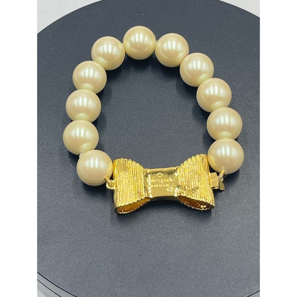 Kate Spade All Wrapped Up Pearl Gold Bow Bracelet - Picture 4 of 13